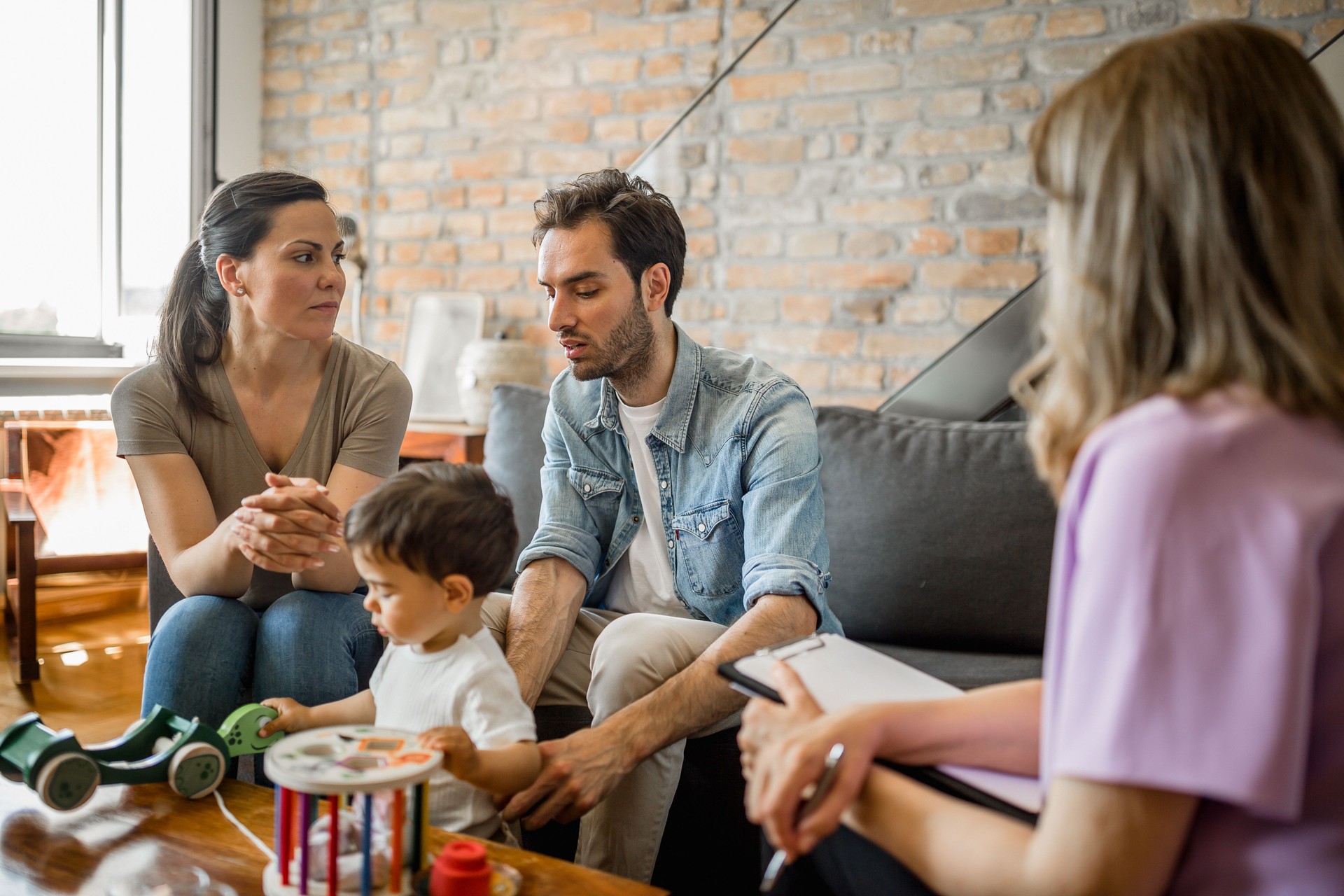 Young couple with a child on a therapy